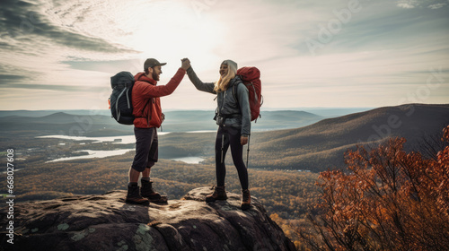 Enthusiasts conquer trail high-five.