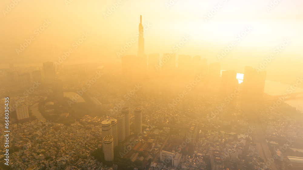 aerial view of early morning at Landmark 81 is a super tall skyscraper in center Ho Chi Minh City, Vietnam and Saigon bridge with development buildings, energy power infrastructure.