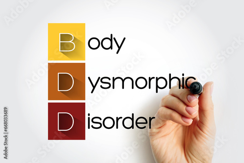 BDD - Body Dysmorphic Disorder acronym, medical concept background photo