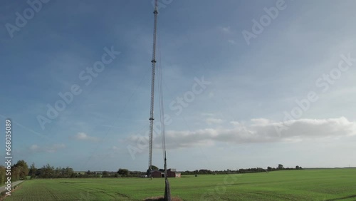 Broadcast Station Antenna on Field GSM Mobile Tower - Panning Shot