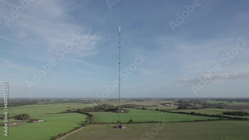 Mobile Telecommunication Cellphone Tower With Sky and Clouds - Panning Shot
