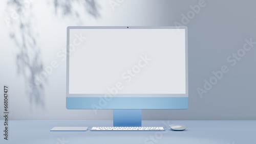 Empty workspace with display computer setup, light workplace in blue colors, and sunlight.