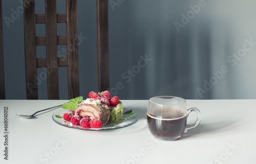 cup of coffee and dessert with raspberries on white table on background blue ...