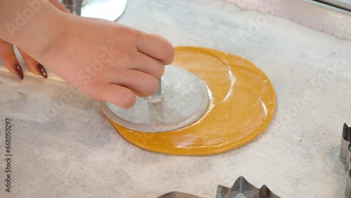 Dalgona Sugar Candy Cooking Process. Hands Close-up Making Round Sugar Cookie photo