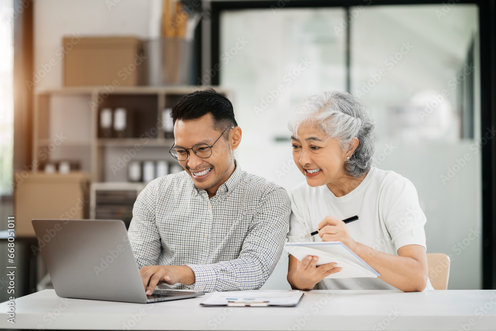 Office worker lifestyle people. Business people writing notes on book and using laptop. home office workplace lifestyle people. Office worker lifestyle people. Business people writing notes on book and using laptop. home office workplace lifestyle people.