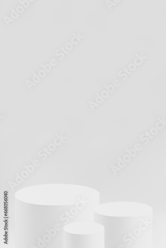 Abstract three white round cylinder podiums for cosmetic products, mockupб white background for presentation products, gifts, goods, advertising, design, sale, text, display, showing in simple style. © finepoints
