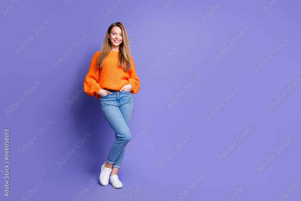 Full body photo of cute cheerful person put arms pockets posing empty space ad isolated on violet color background