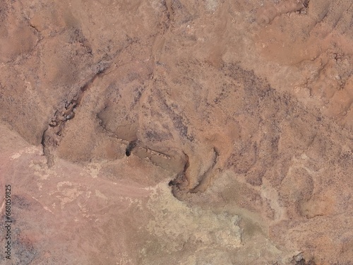 view of the desert , mars like terrain, erosion channels, mars colour photo