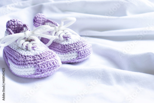 Knitted booties socks on a white background for newborns