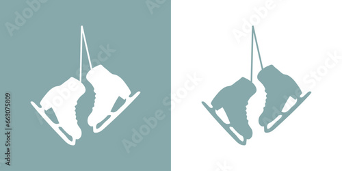 Logo winter sports. Silueta de un par de patines para hielo colgando de cordones. Botas para patinaje sobre hielo photo