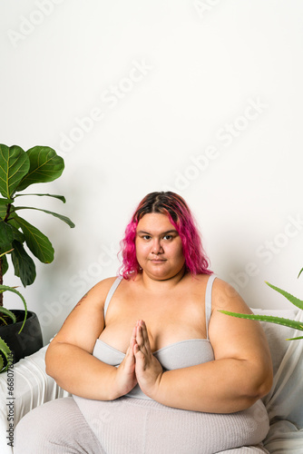Woman relaxing sitting down on the couch meditation