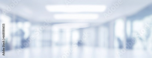 Beautiful light blue blurred background panoramic image of a spacious office or mall hallway.
