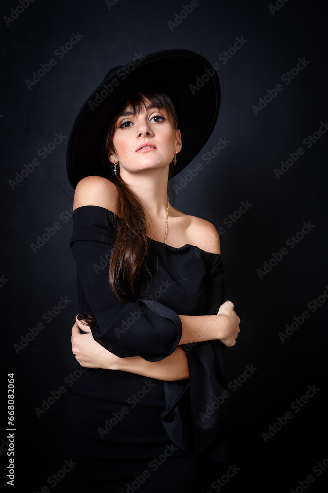 Elegant Woman in Black Hat and Off-Shoulder Dress Elegant Woman in Black Hat and Off-Shoulder Dress