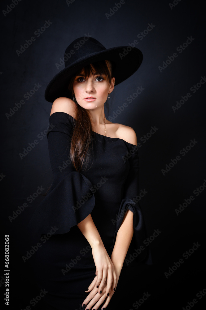 Elegant Woman in Black Hat and Off-Shoulder Dress Elegant Woman in Black Hat and Off-Shoulder Dress