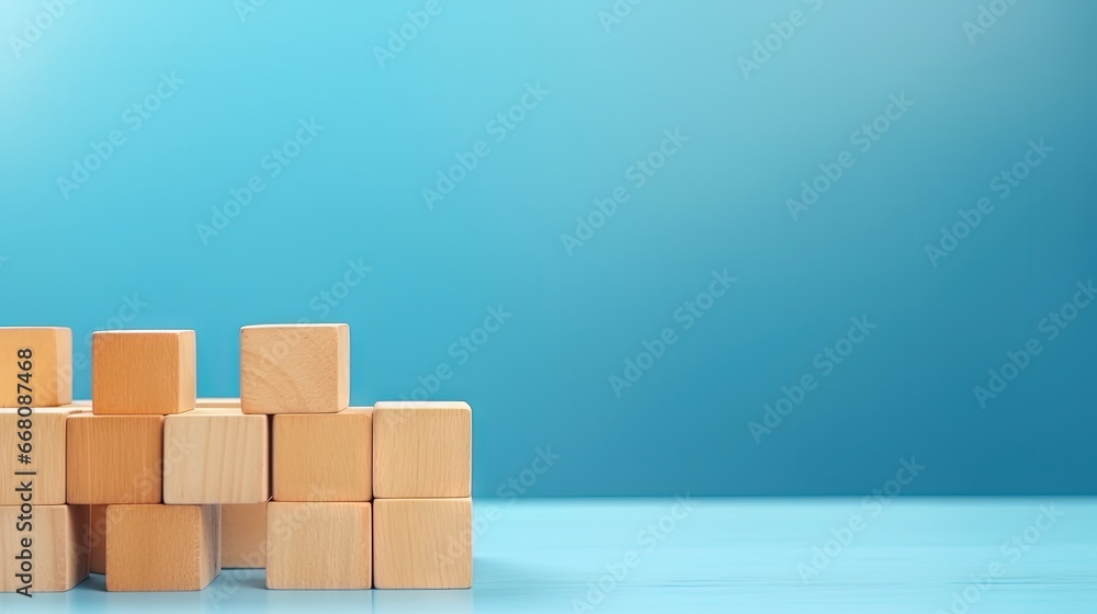 Wooden cubes on blue table with space for text representing business mission core values and solutions Wooden cubes on blue table with space for text representing business mission core values and solutions