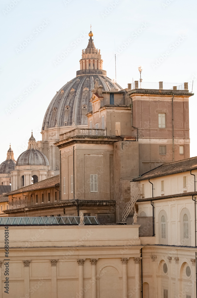 Fragment of Basilica of St. Peter in the Vatican and column on Saint Peters square in Vatican