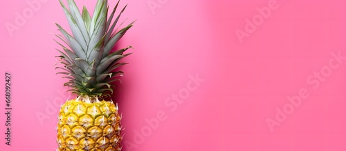 Bright pink background with pineapple