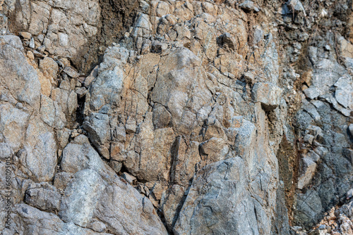 Rock structure, background. Natural rock background. Cracks and natural shapes of rocks