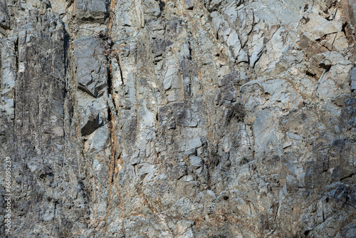 Rock structure  background. Natural rock background. Cracks and natural shapes of rocks
