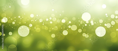 Blurred background with bokeh circles in olive and green