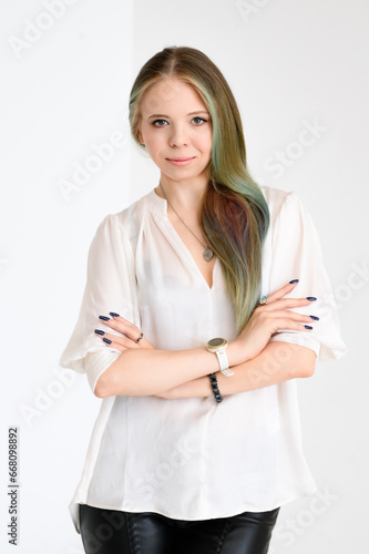 Wallpaper Mural Graceful Young Woman in White Blouse with Green Hair Highlights on Light Background Torontodigital.ca