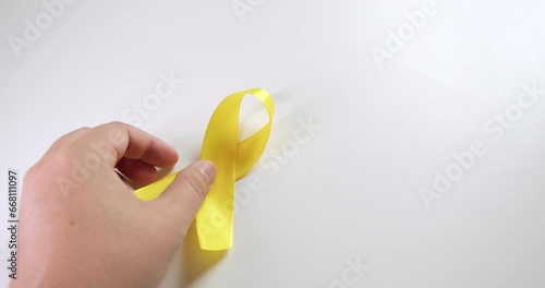 Yellow ribbons signifies mainly for suicide prevention and liver disease and cancer awareness, especially in children. photo