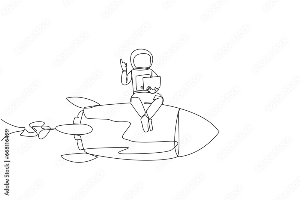 Single continuous line drawing young energetic astronaut sitting on flying rocket holding laptop raise one hand. Expedition to repair damage near the lunar surface. One line design vector illustration