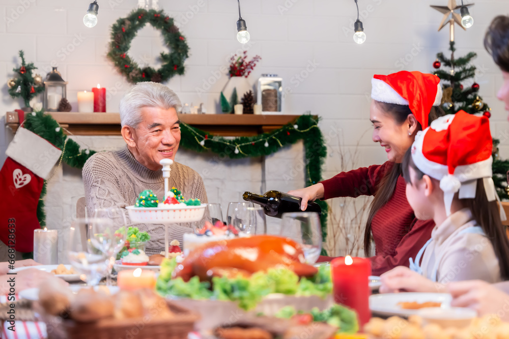 Asian family's Christmas celebration in their home Eating together at the dining table