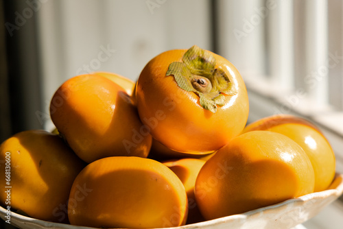 persimmon fruit on a plate