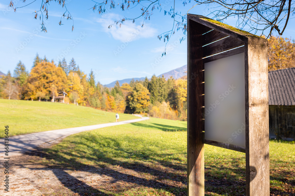 Fototapeta premium Empty Information board in nature showing trail map