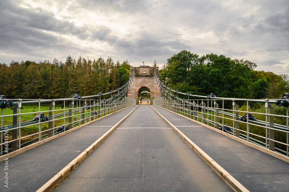 Halfway over the Union Chain Bridge, a suspension road bridge that spans the River Tweed between England and Scotland located four miles upstream of Berwick Upon Tweed