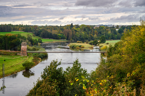 Elevated View of the Union Chain Bridge  a suspension road bridge that spans the River Tweed between England and Scotland located four miles upstream of Berwick Upon Tweed