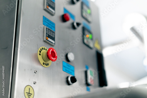 Temperature control panel with buttons on a refrigerator in specialty alcoholic beverage production plant
