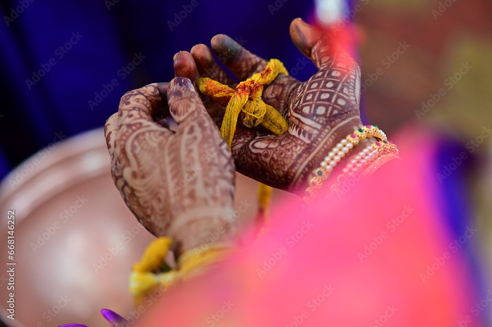 Turmeric Thread with red powder on hand of bride. Hands of bride and ...