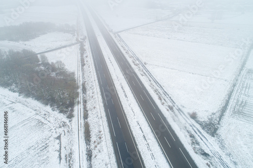 aerial view with drone of the a-52 highway after a snowstorm. A Limia, Ourense. Galicia, Spain