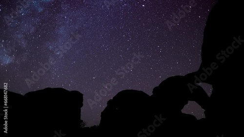 nightscape, night full of stars, Arches Natioal Park, the milkyway rising behind the Double Arch