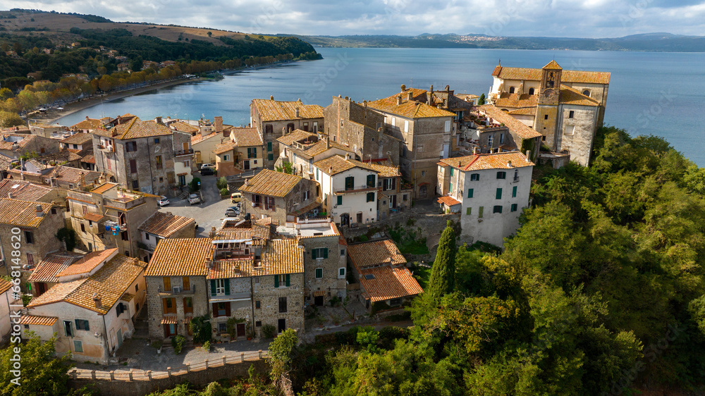 Aerial view of the historic center of Anguillara, in the metropolitan city of Rome, Italy. The town is located on the shores of Lake Bracciano.