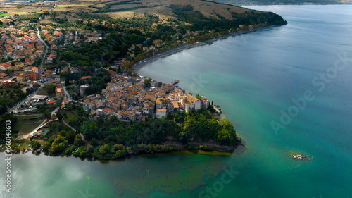 Fototapeta Naklejka Na Ścianę i Meble -  Aerial view of the historic center of Anguillara, in the metropolitan city of Rome, Italy. The town is located on the shores of Lake Bracciano.