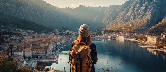 casual solo traveller female woman standing on the hill look over aerial topview of old famous attraction city travel concept carefree leisure freedom concept