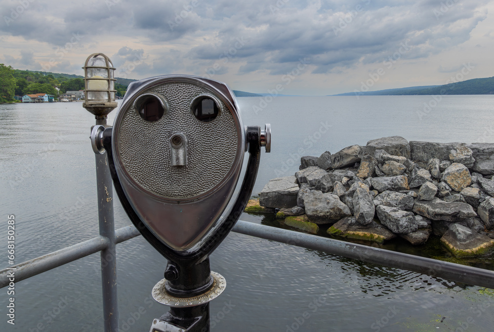 Binoculars on the pier overlooking Lake Seneca at Watkins Glen, NY, United States Binoculars on the pier overlooking Lake Seneca at Watkins Glen, NY, United States