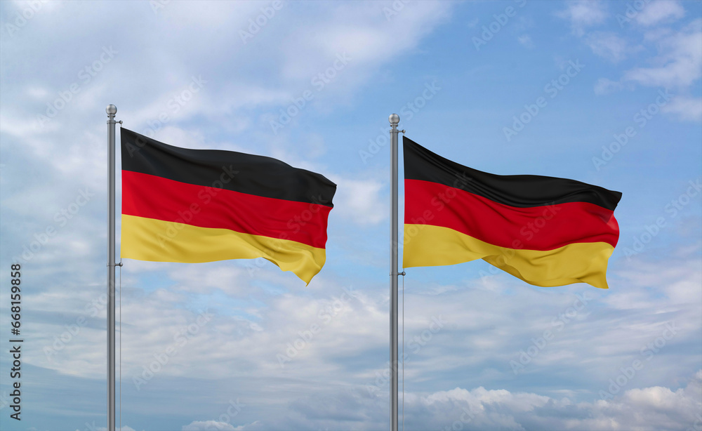 Two Germany flags, country relationship concept Two Germany flags, country relationship concept