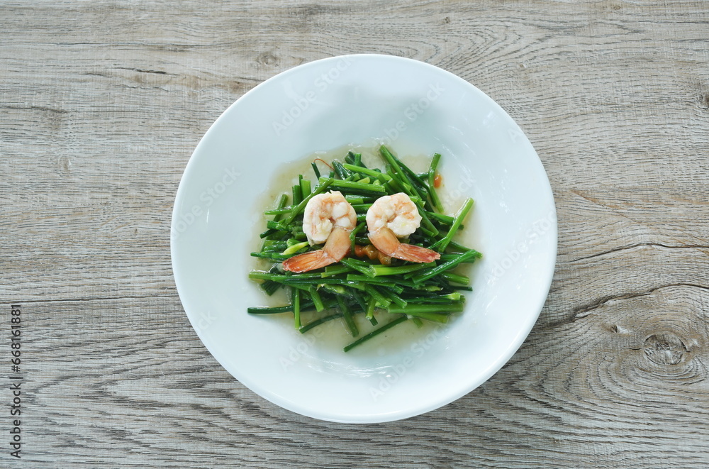 stir fried garlic chives with shrimp in soy sauce on plate stir fried garlic chives with shrimp in soy sauce on plate
