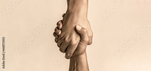 Helping hand concept and international day of peace, support. Helping hand outstretched, isolated arm, salvation. Close up help hand. Two hands, helping arm of a friend, teamwork