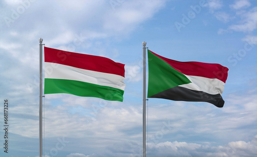 Sudan and Hungary flags, country relationship concept photo