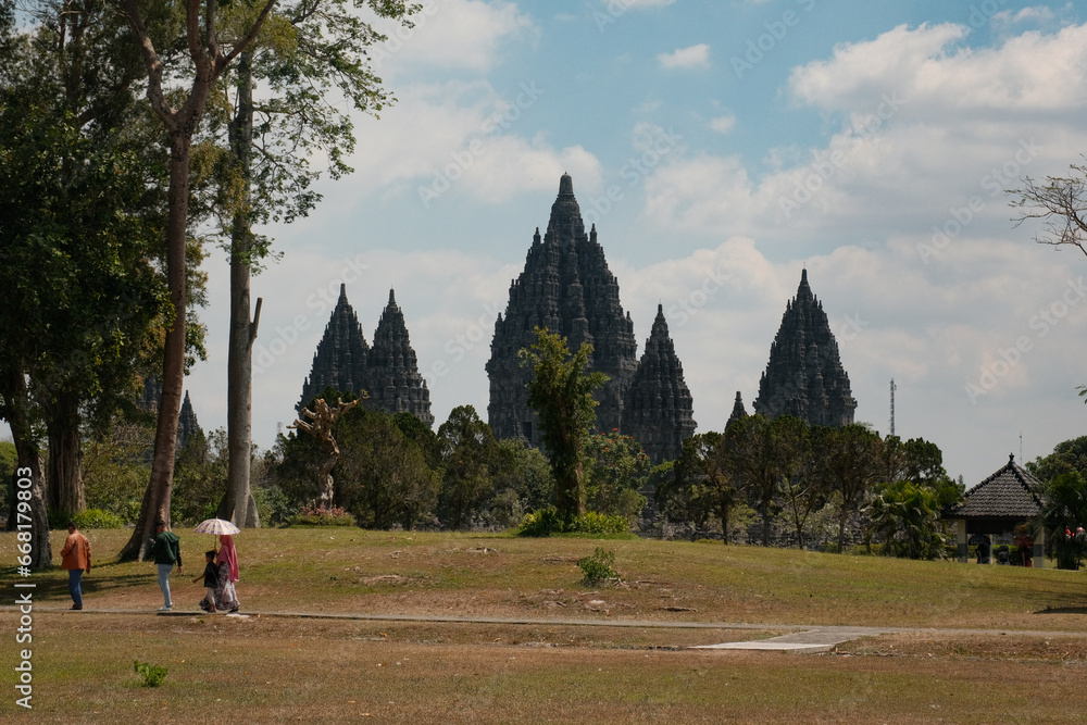 Prambanan Temple in Yogyakarta, Captured from Outside, With a Family Strolling Nearby