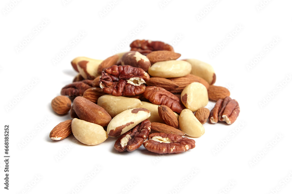 Mixed nuts isolated on white background. Almonds, Brazil nuts and peeled pecans mix. Wholesome nut assortment for energy. Mixed nuts isolated on white background. Almonds, Brazil nuts and peeled pecans mix. Wholesome nut assortment for energy.