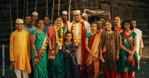Canvas Print Portrait of an Extended Indian Family Taking a Photo on a Traditional Wedding