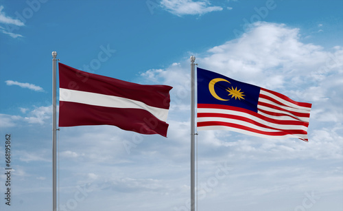 Malaysia and Latvia flags, country relationship concept