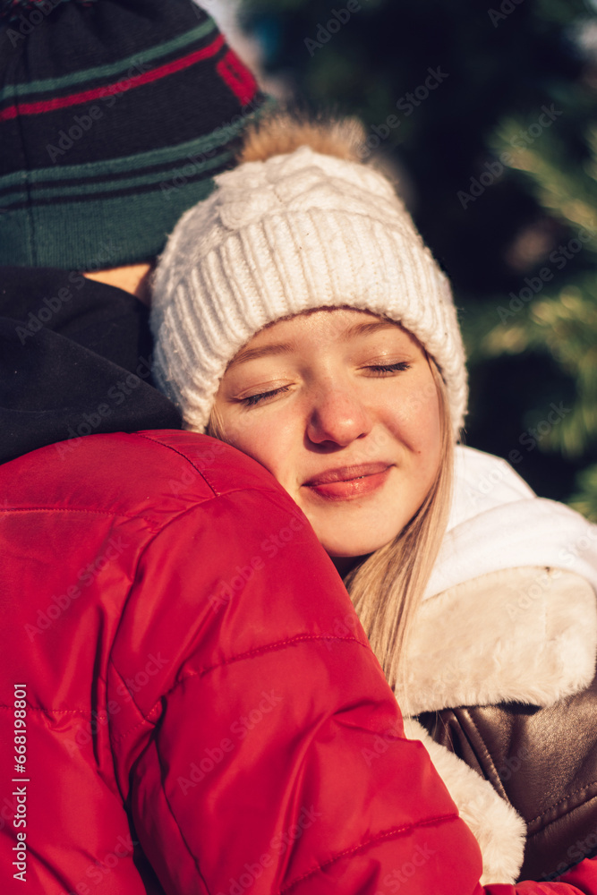 Young couple in love have fun, active date in winter on Christmas Eve.Winter entertainment,leisure activity. Young couple in love have fun, active date in winter on Christmas Eve.Winter entertainment,leisure activity.