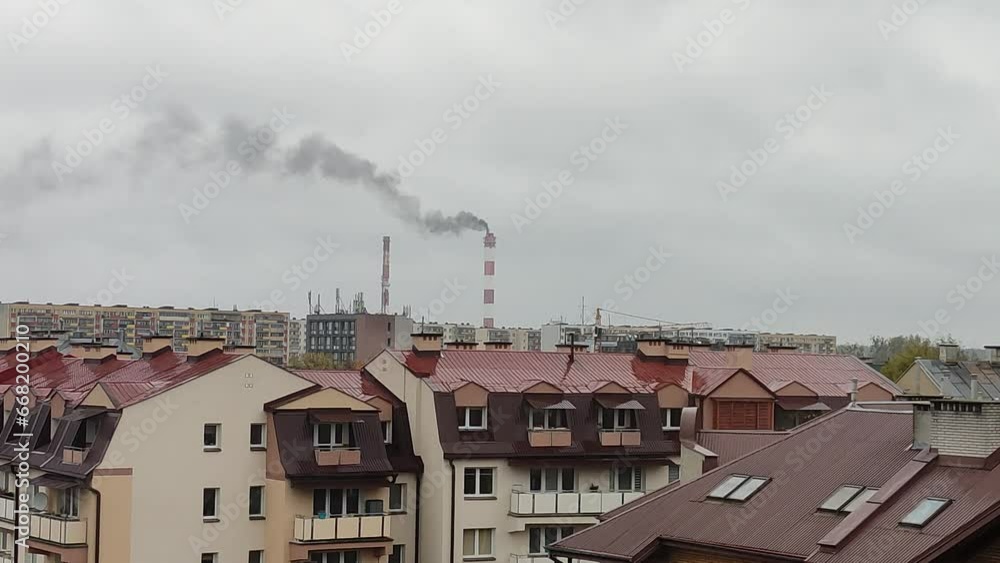 Chimney of a heating station smokes black smoke on the cityscape Chimney of a heating station smokes black smoke on the cityscape